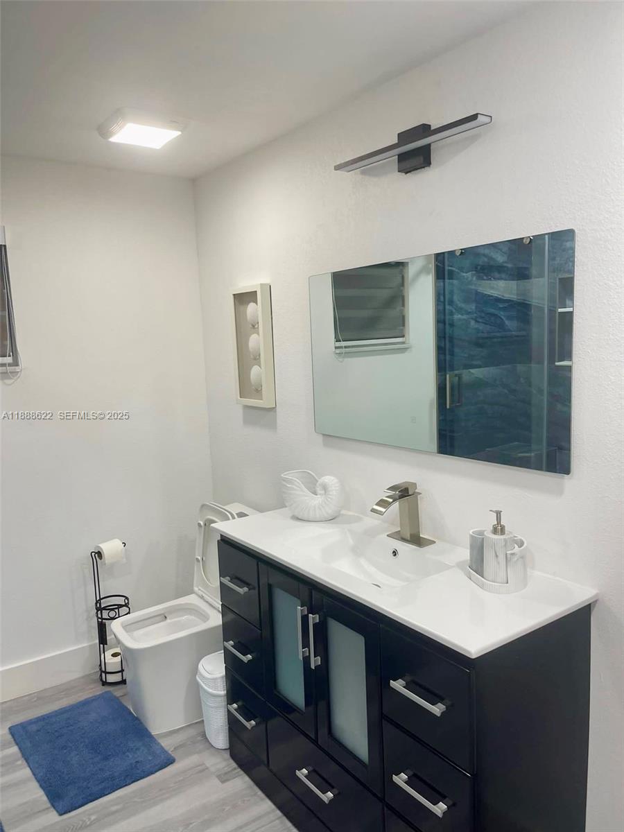 20 Eagle Drive Key Largo, FL 33037 - Photo 38 of 55 a bathroom with a sink a toilet and mirror