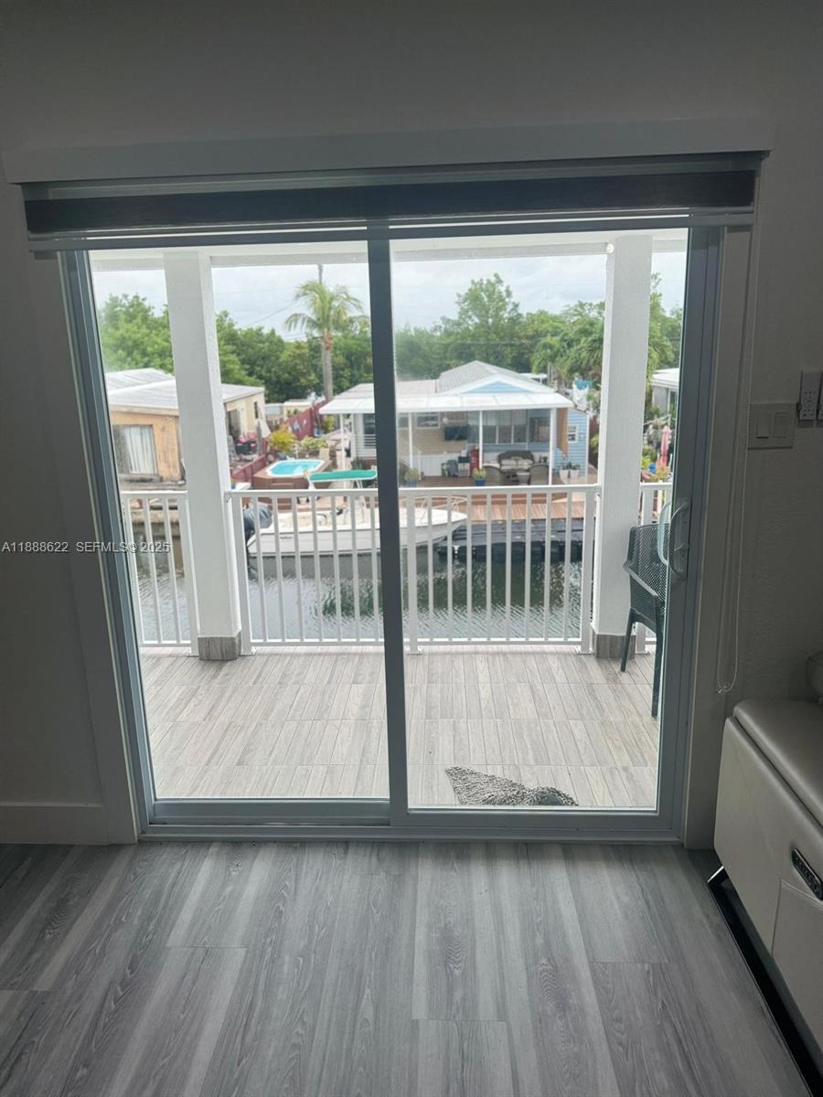 20 Eagle Drive Key Largo, FL 33037 - Photo 46 of 55 a view of porch with wooden floor and outdoor view