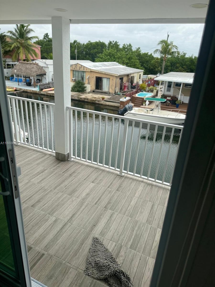 20 Eagle Drive Key Largo, FL 33037 - Photo 47 of 55 a view of a balcony with wooden floor