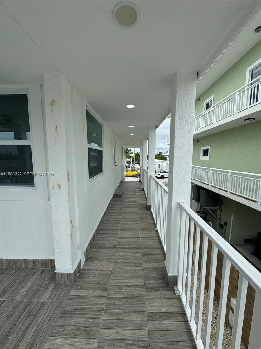 20 Eagle Drive Key Largo, FL 33037 - Photo 48 of 55 a view of a hallway with wooden floor and staircase