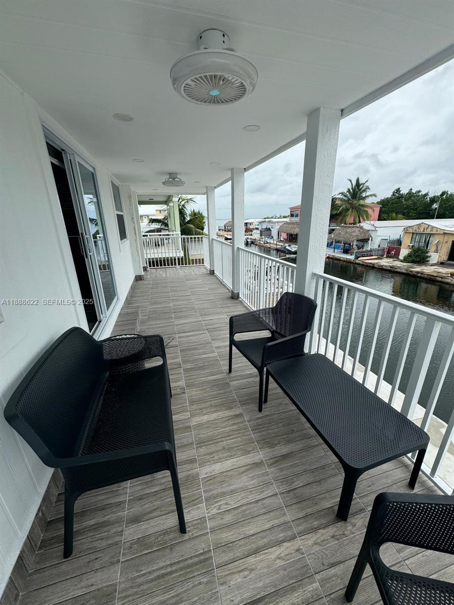 20 Eagle Drive Key Largo, FL 33037 - Photo 49 of 55 a living room with furniture and a floor to ceiling window