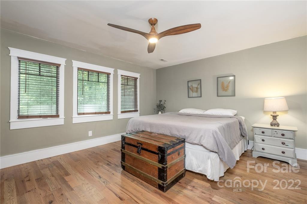 5932 Deal Road Matthews, NC 28104 - Photo 16 of 41 a spacious bedroom with a bed and a large window