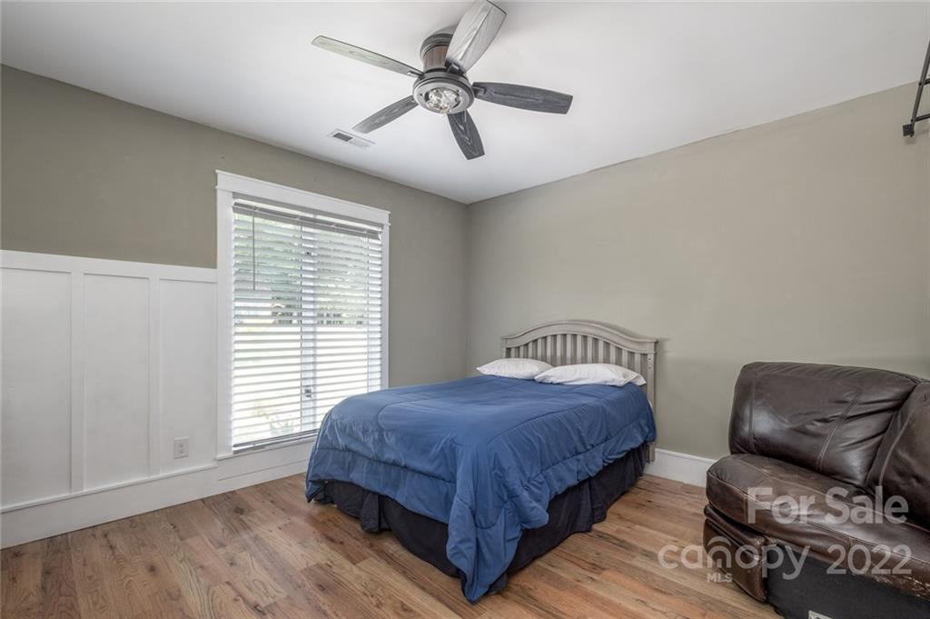 5932 Deal Road Matthews, NC 28104 - Photo 18 of 41 a bedroom with a bed and a chair