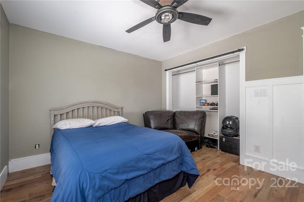 5932 Deal Road Matthews, NC 28104 - Photo 19 of 41 a bedroom with a bed and wooden floor