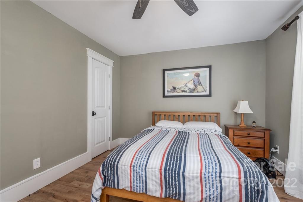 5932 Deal Road Matthews, NC 28104 - Photo 21 of 41 a bedroom with a bed and painting on the wall