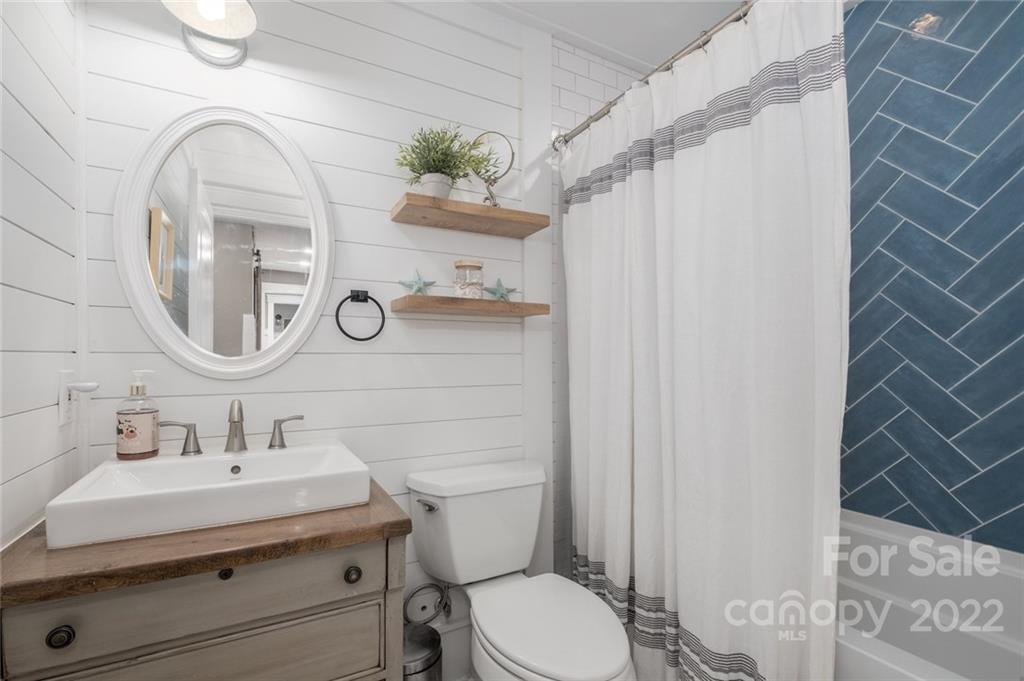 5932 Deal Road Matthews, NC 28104 - Photo 24 of 41 a bathroom with a sink mirror and toilet