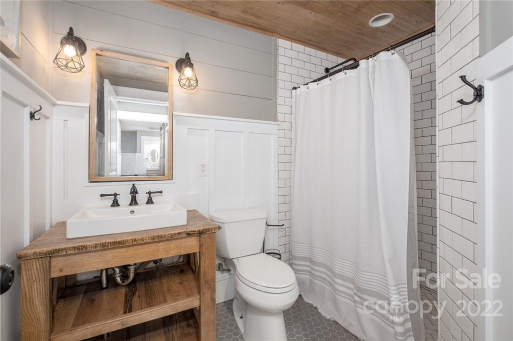 5932 Deal Road Matthews, NC 28104 - Photo 25 of 41 a bathroom with a sink toilet and mirror