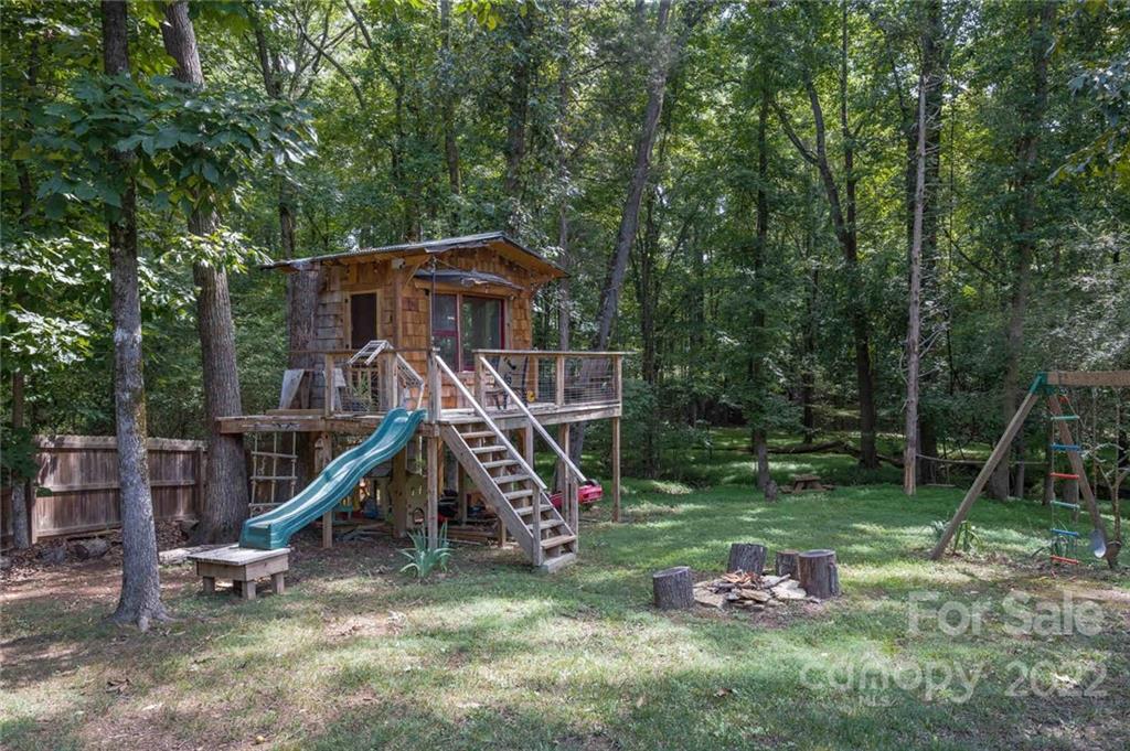 5932 Deal Road Matthews, NC 28104 - Photo 30 of 41 a view of a backyard with a slide