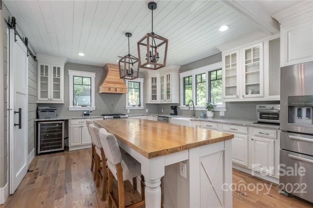 5932 Deal Road Matthews, NC 28104 - Photo 7 of 41 a kitchen with a center island appliances and cabinets