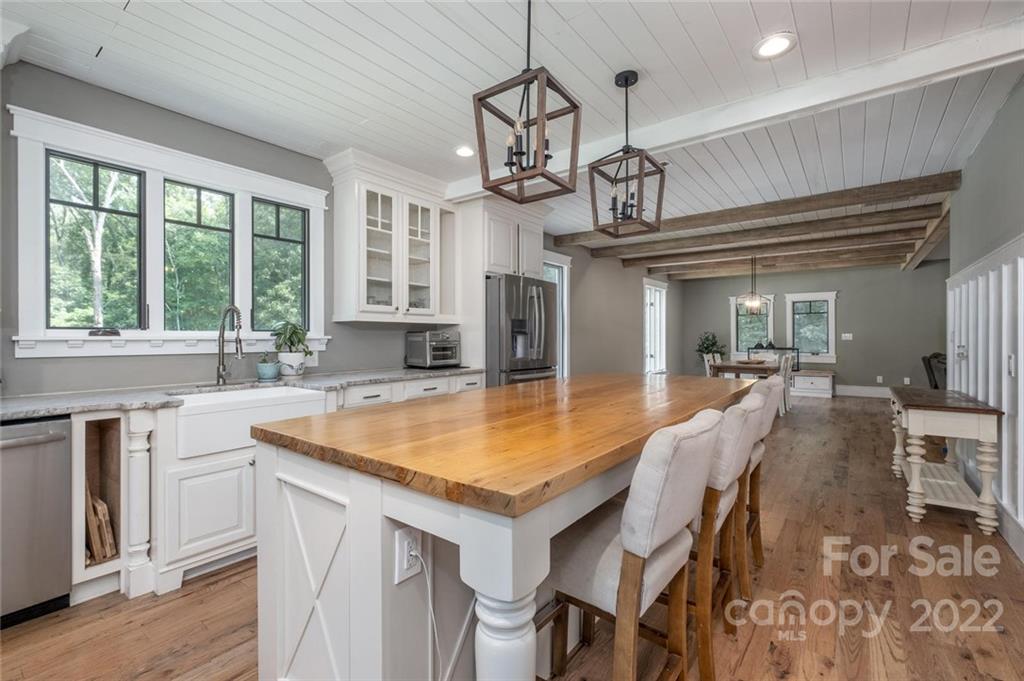 5932 Deal Road Matthews, NC 28104 - Photo 8 of 41 a kitchen with a table chairs sink and cabinets