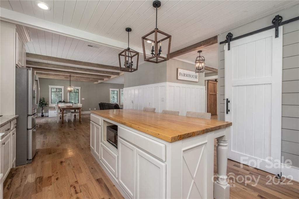 5932 Deal Road Matthews, NC 28104 - Photo 9 of 41 a kitchen with stainless steel appliances granite countertop a sink a stove top oven a counter space and cabinets