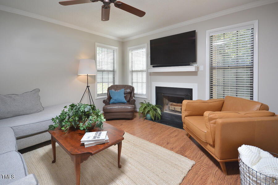 3702 Chimney Ridge Place, Unit 105 Durham, NC 27713 - Photo 12 of 32 Living room has four windows to bring in an abundance of natural light.