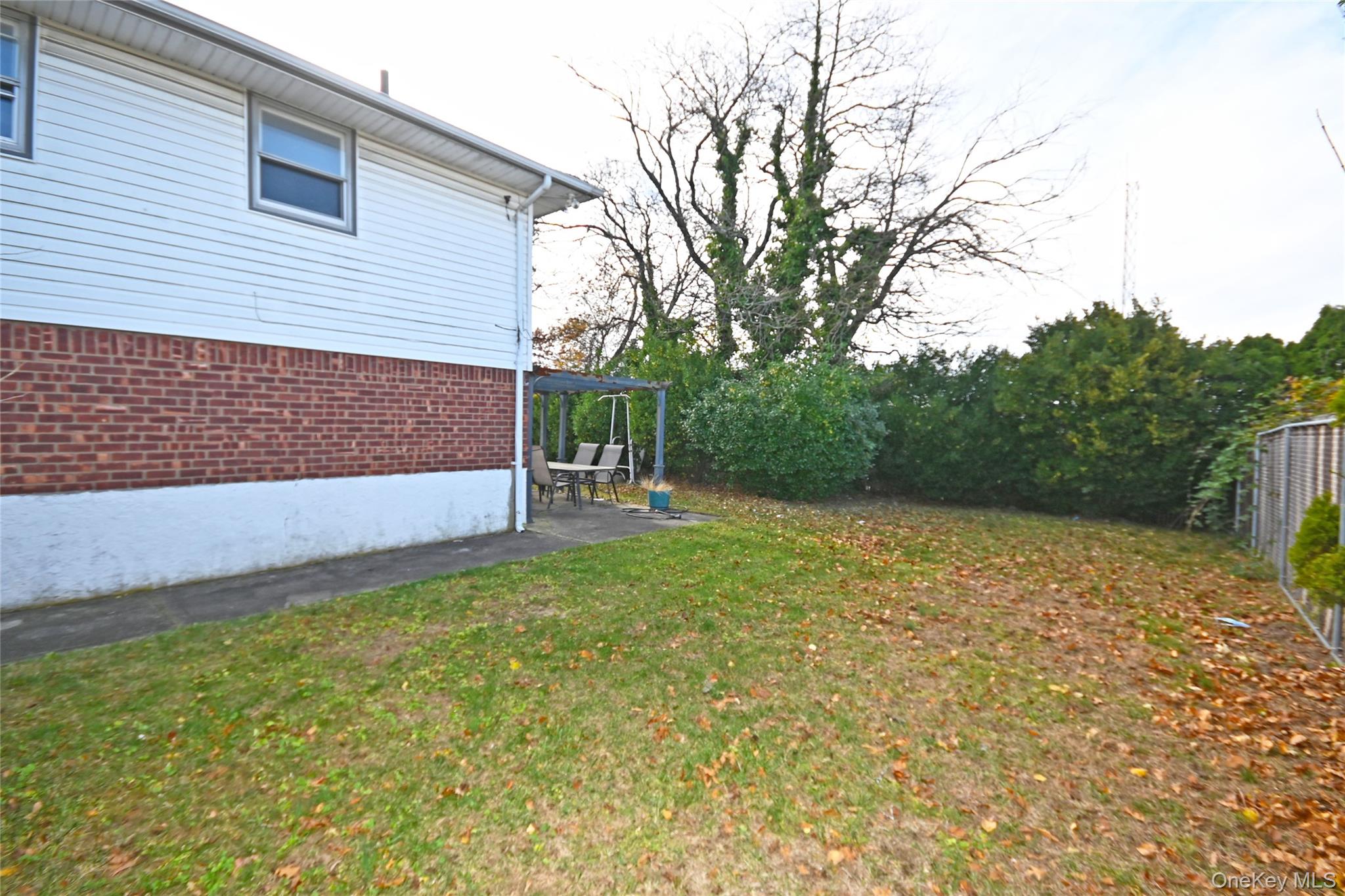 89 Osborne Road West Hempstead, NY 11552 - Photo 4 of 50 View of yard featuring a patio and a pergola