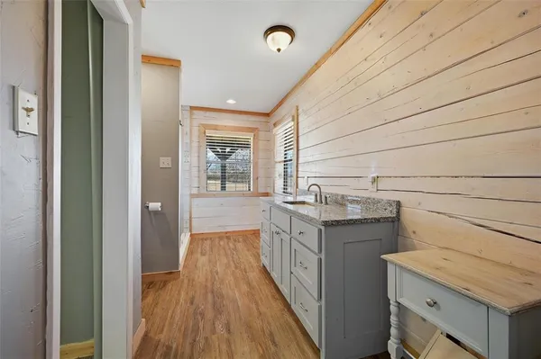 a bathroom with a toilet and shower