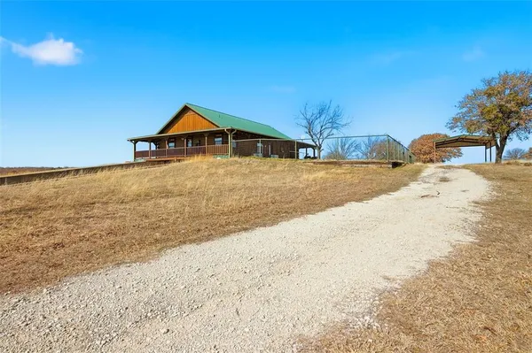 a house with trees in the background