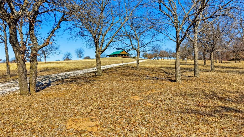 3078 Admire Road Nocona, TX 76255 - Photo 3 of 40 a view of yard covered with snow