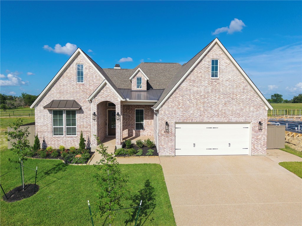 7052 Skipping Rock Path Bryan, TX 77808 - Photo 1 of 23 a view of a house with backyard