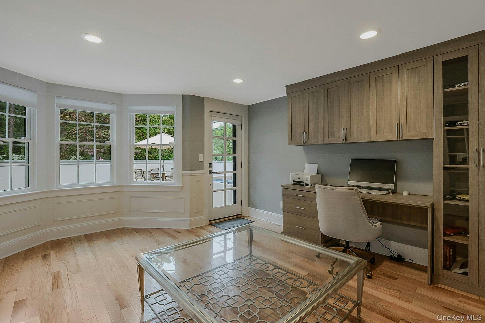 236 Berry Hill Road Syosset, NY 11791 - Photo 13 of 27 Office space with built in study area, light wood-type flooring, recessed lighting, wainscoting, and a decorative wall