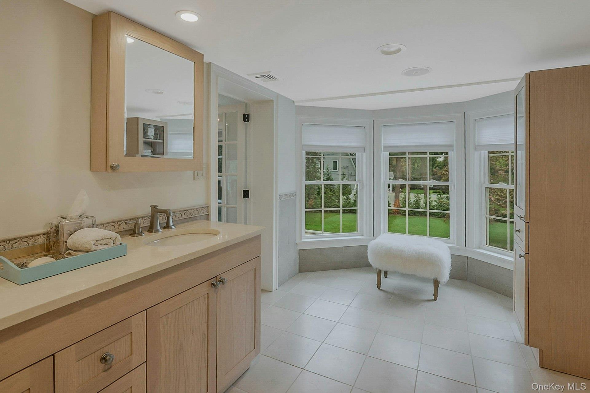 236 Berry Hill Road Syosset, NY 11791 - Photo 19 of 27 Bathroom featuring vanity, light tile patterned floors, and recessed lighting