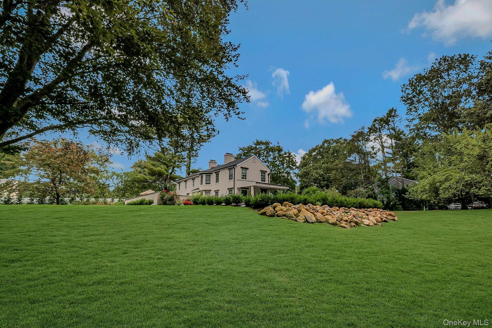 236 Berry Hill Road Syosset, NY 11791 - Photo 2 of 27 View of grassy yard featuring view of scattered trees