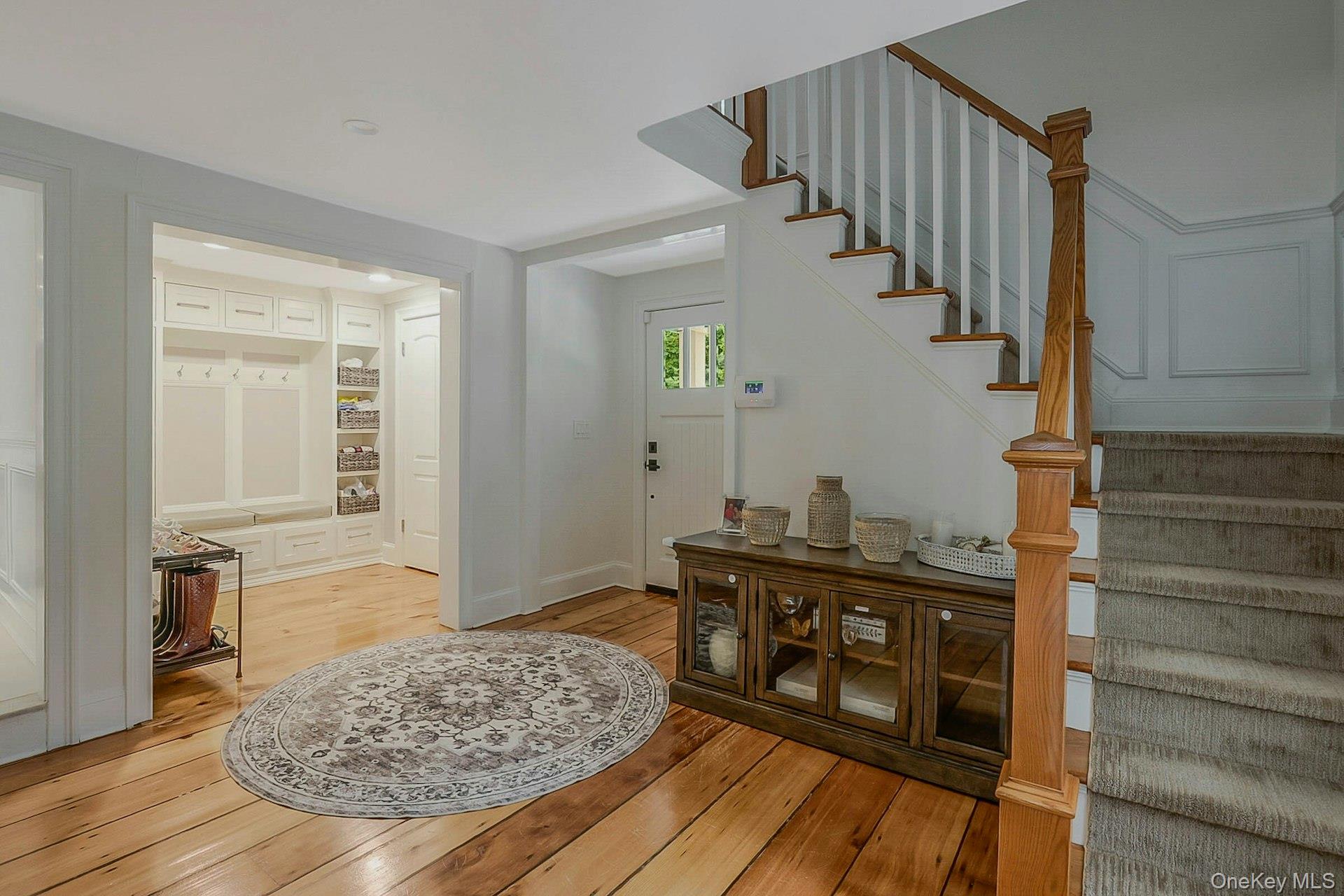 236 Berry Hill Road Syosset, NY 11791 - Photo 4 of 27 Entrance foyer featuring light wood-type flooring and stairway