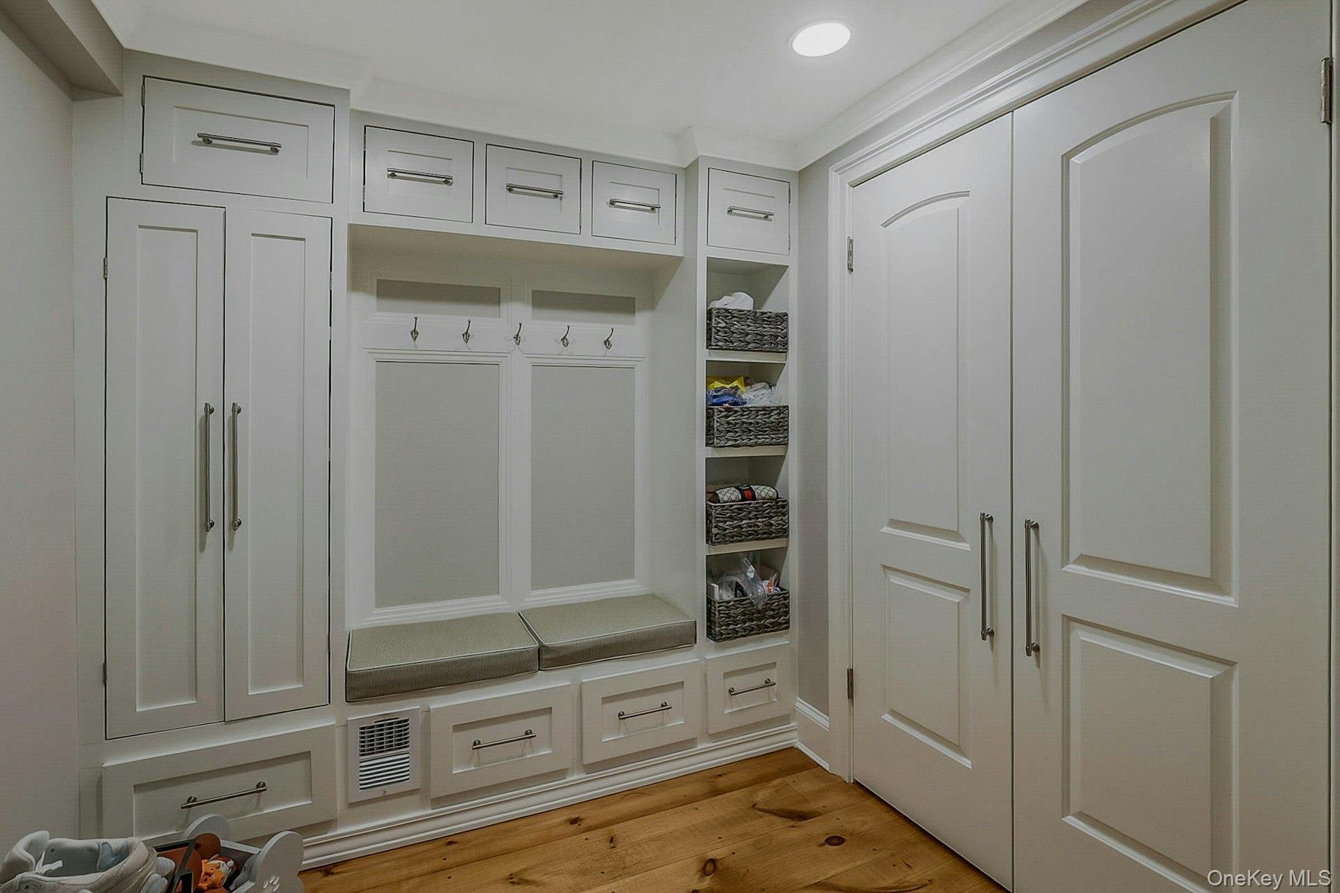 236 Berry Hill Road Syosset, NY 11791 - Photo 5 of 27 Mudroom with light wood-style flooring and recessed lighting