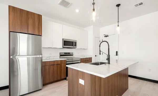 a picture of a bench in front of a building