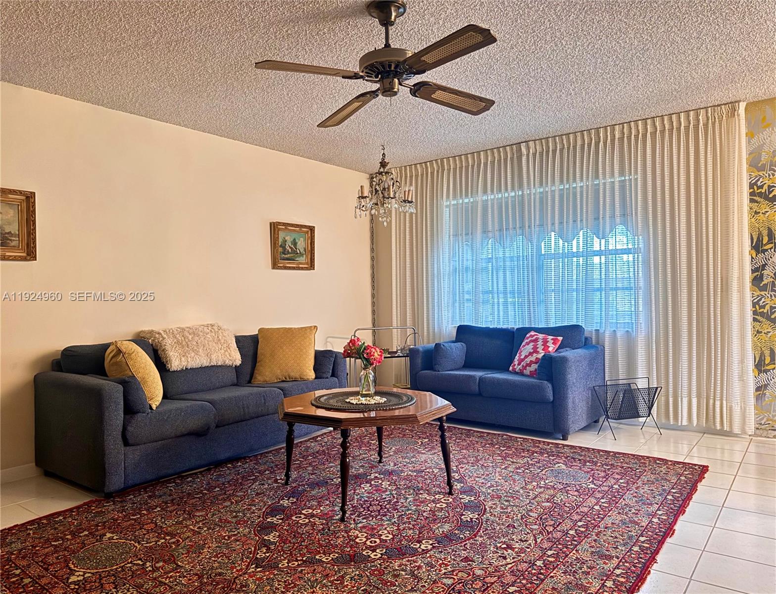 a living room with furniture and a rug