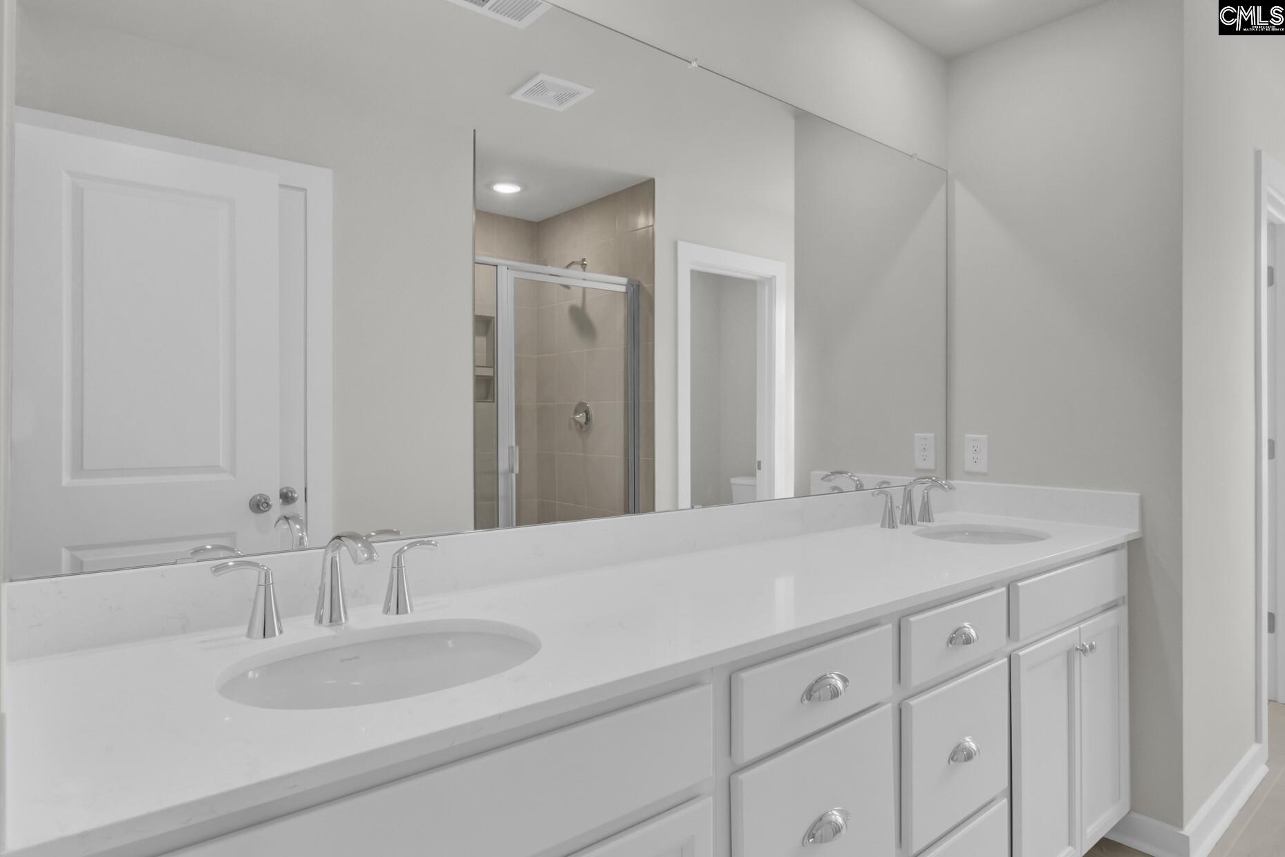 320 Brass Billion Path Lexington, SC 29073 - Photo 22 of 39 a bathroom with a sink and a mirror