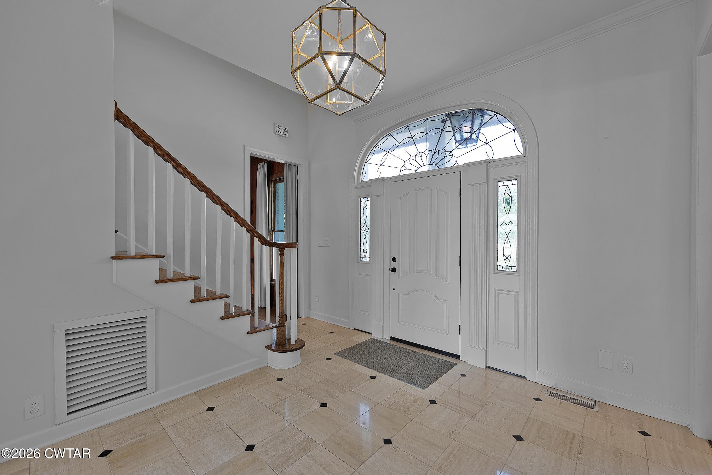 58 Huntington Place Jackson, TN 38305 - Photo 12 of 38 wooden floor in an entryway with a chandelier