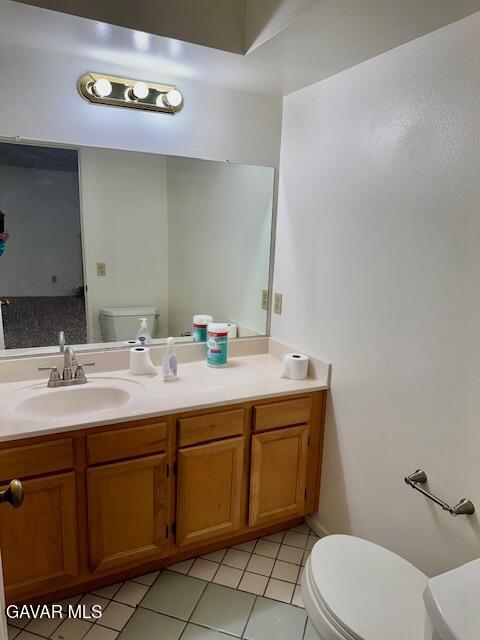 44128 Fine Circle Lancaster, CA 93536 - Photo 15 of 63 a bathroom with a toilet sink and mirror