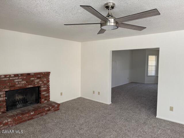 44128 Fine Circle Lancaster, CA 93536 - Photo 16 of 63 a living room with a fireplace and a ceiling fan