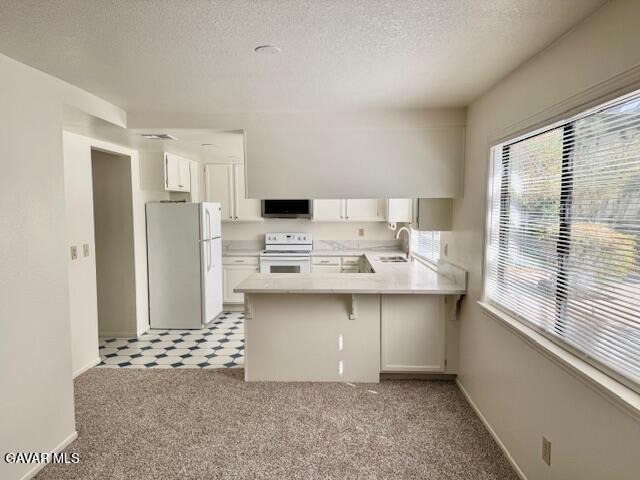 44128 Fine Circle Lancaster, CA 93536 - Photo 18 of 63 a kitchen with stainless steel appliances a sink stove and refrigerator