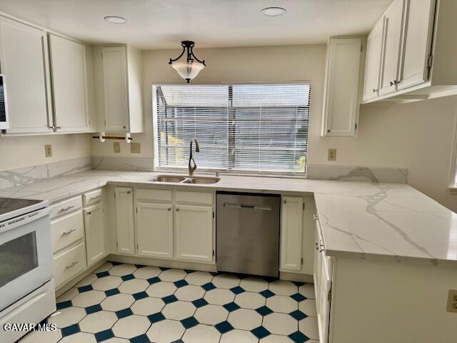 44128 Fine Circle Lancaster, CA 93536 - Photo 20 of 63 a kitchen with a sink stove and cabinets