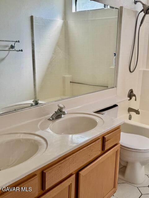 44128 Fine Circle Lancaster, CA 93536 - Photo 29 of 63 a bathroom with a sink a toilet and a mirror