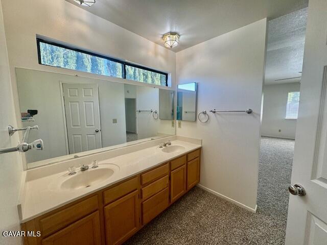 44128 Fine Circle Lancaster, CA 93536 - Photo 38 of 63 a spacious bathroom with a double vanity sink mirror and double