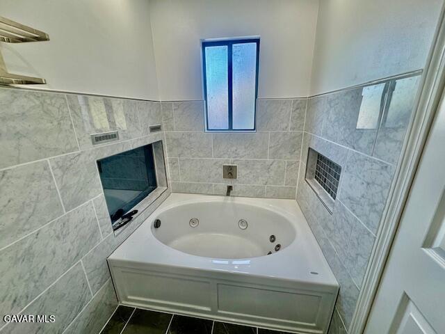 44128 Fine Circle Lancaster, CA 93536 - Photo 44 of 63 a bathroom with a tub a sink and a shower