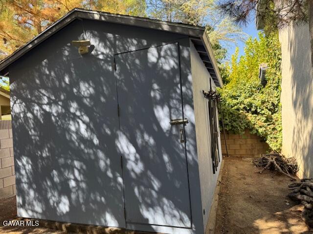 44128 Fine Circle Lancaster, CA 93536 - Photo 58 of 63 a view of a wooden door of the house