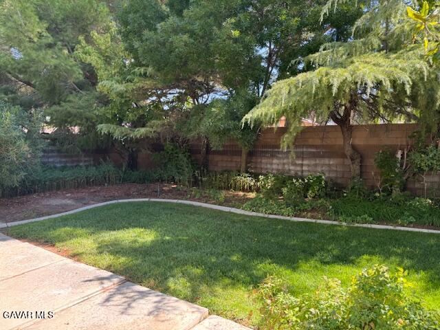 44128 Fine Circle Lancaster, CA 93536 - Photo 60 of 63 a view of a swimming pool with a yard