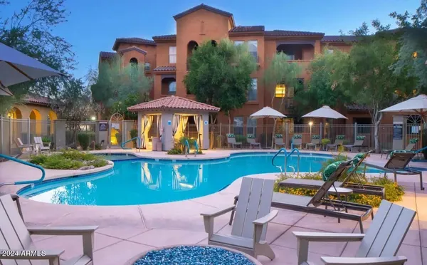 a view of house with swimming pool outdoor seating area and furniture