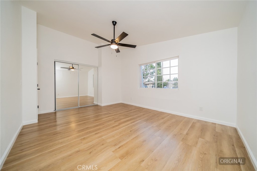 555 North Chestnut Avenue Rialto, CA 92376 - Photo 18 of 33 a view of empty room with wooden floor and fan
