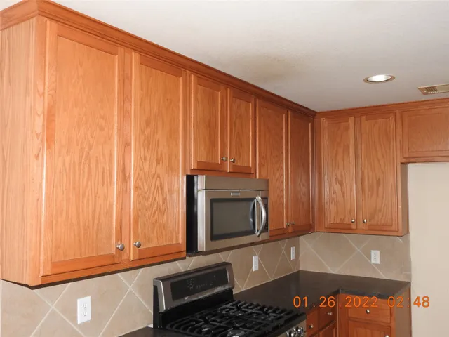 a room with a fireplace and a window