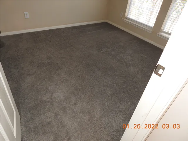 a view of a closet in an empty room