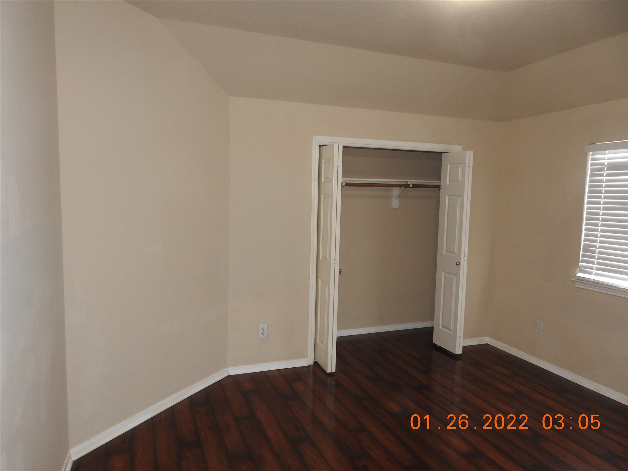 24227 Silversmith Lane Katy, TX 77493 - Photo 30 of 42 an empty room with wooden floor and windows