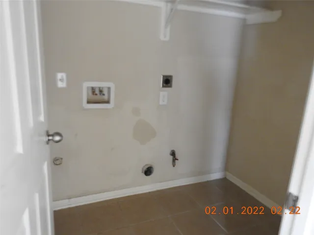 a view of a backyard with wooden fence