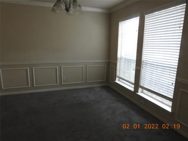 a view of an empty room and window