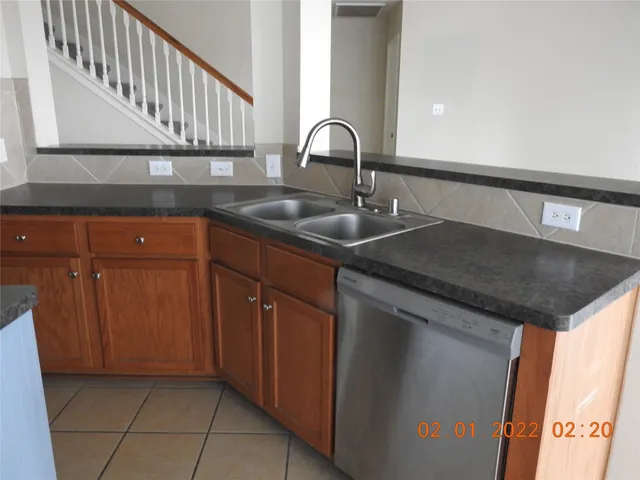 a kitchen with a sink and cabinets