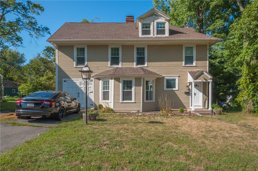 487 Wells Road Wethersfield, CT 06109 - Photo 1 of 1 a front view of a house with a garden