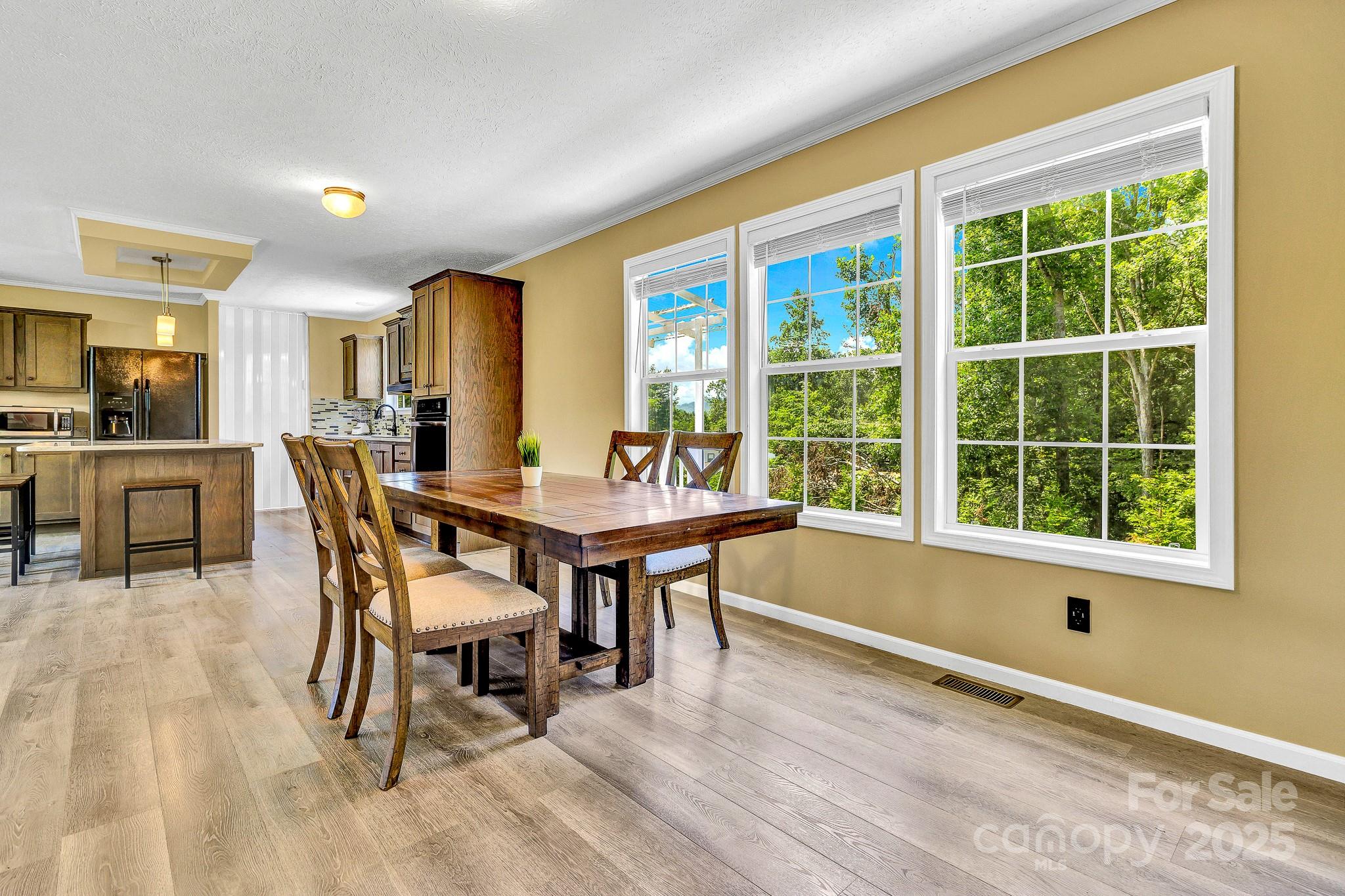 185 Bradshaw Circle Candler, NC 28715 - Photo 17 of 38 a dining room with furniture and wooden floor