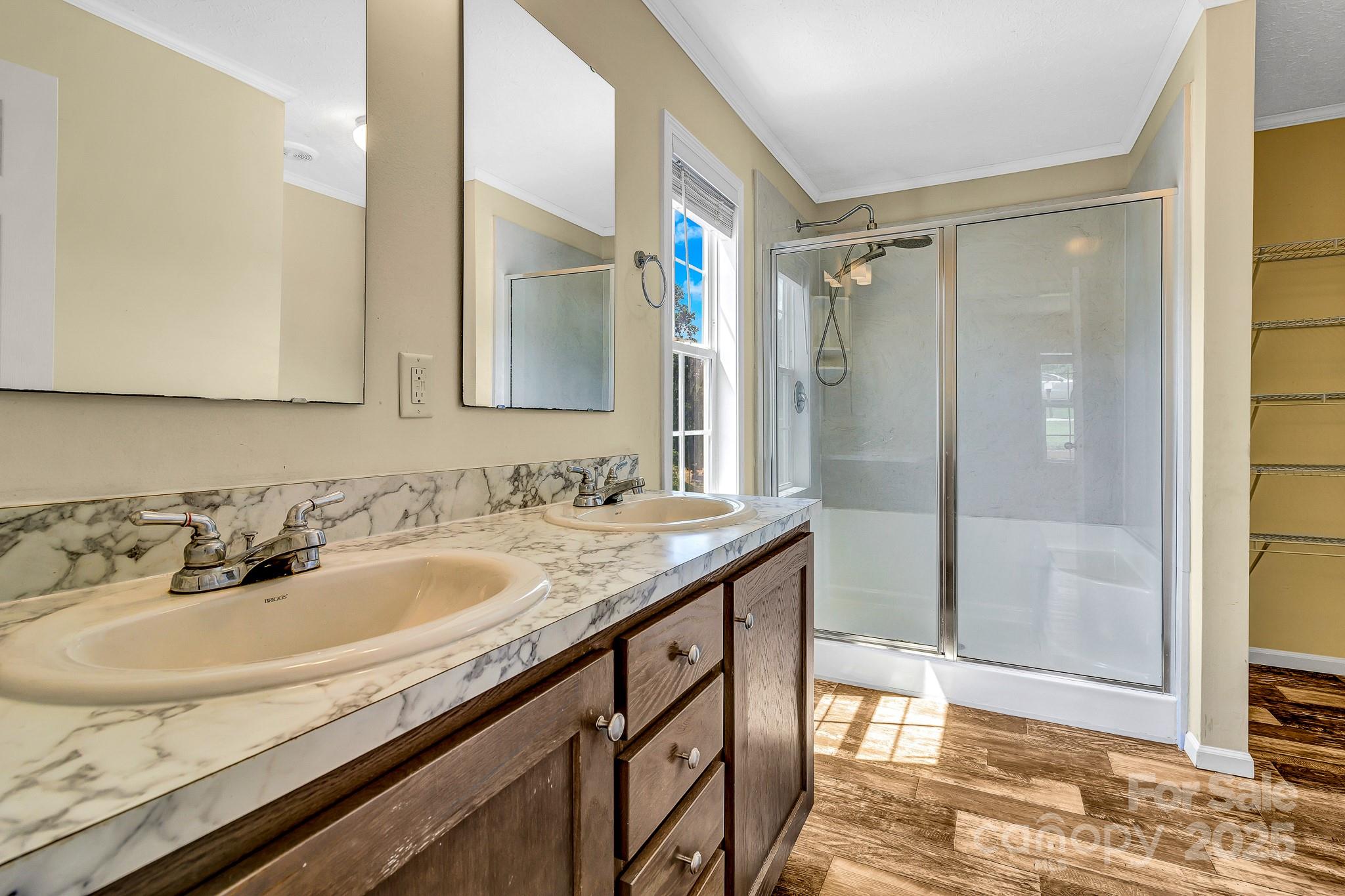 185 Bradshaw Circle Candler, NC 28715 - Photo 22 of 38 a bathroom with a sink and a mirror